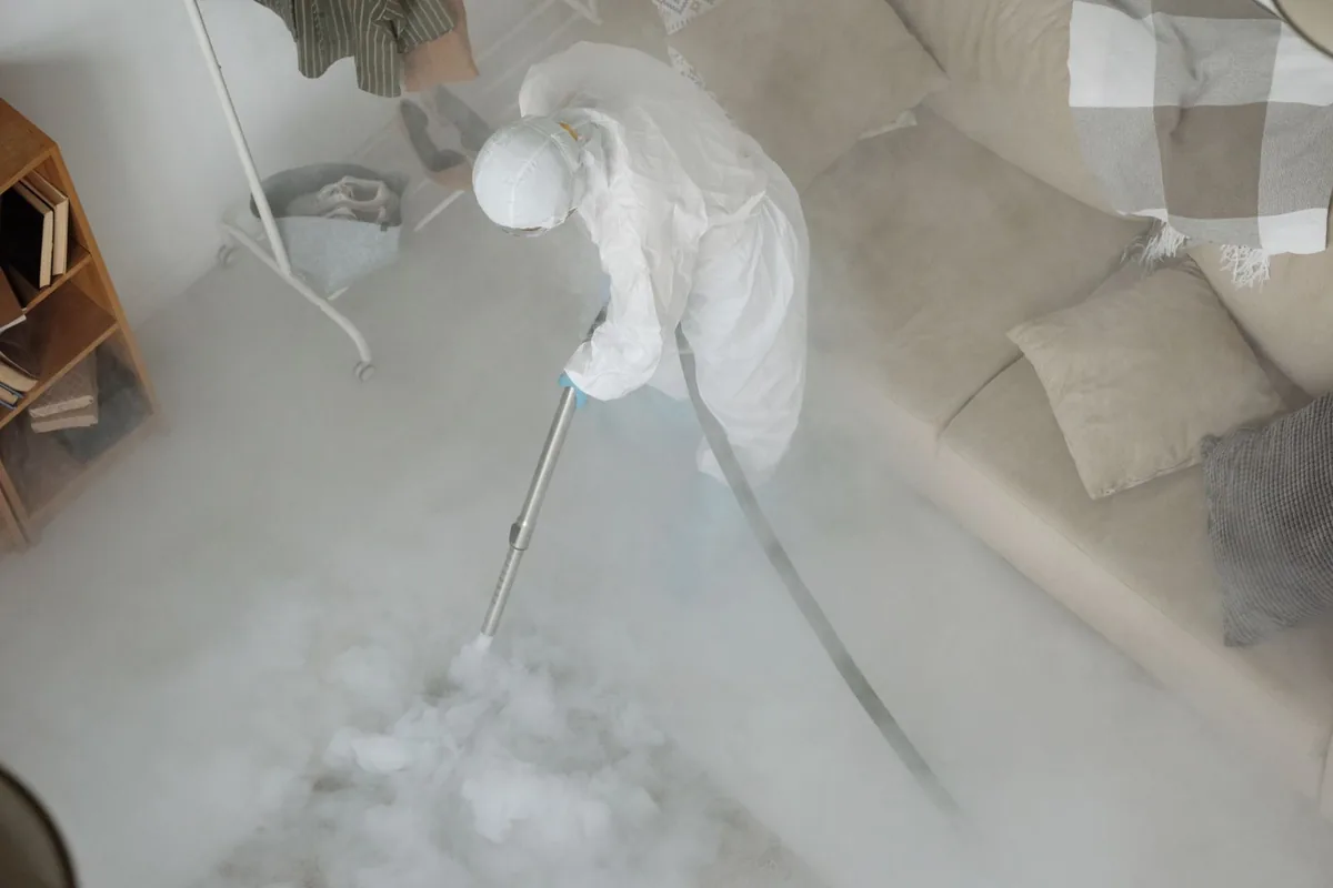 Biohazard cleanup technician in protective equipment, Ormond Beach, FL